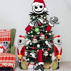 a decorated christmas tree in the corner of a room with two stuffed animals sitting next to it