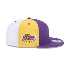 The Los Angeles Lakers Front Logoman 9FIFTY Snapback features an embroidered Lakers themed NBA Logoman at the front panels with a snapback closure at the rear. Additional details include a team logo patch at the right-wear side, a team color crown, a purple visor, and a gray undervisor. Throwback Snapback Hat For Baseball Season, Throwback Snapback Baseball Cap For College, Throwback Snapback Cap For Game Day, Throwback White Snapback Baseball Cap, Fan Gear Snapback Hat With Team Logo, Snapback Hat With Team Logo For Fans, Snapback Hat With Team Logo For Fan Gear, Fan Merchandise Snapback Hat With Team Logo, Flat Bill Snapback Hat With Team Logo