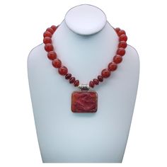 One-of-a-Kind Richly colored 18m.m. Carnelian gemstone necklace. The red Carnelian pendant suspended from the necklace is a 2”x11/2 Carnelian Dragon richly carved into the stone. The dragon symbol of the emperor in China is particularly powerful when it is in red the symbol also symbolizes good fortune. The clasp is a carnelian cabochon set in sterling silver. Silk hand-knotted Approx: 18 inch . Dragon Symbol, Necklace Dragon, Red Carnelian, Carnelian Necklace, Silver Silk, Carnelian Pendant, The Emperor, Dragon Pendant, Cabochon Pendant