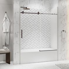 a bathroom with marble walls and flooring, including a walk - in shower stall