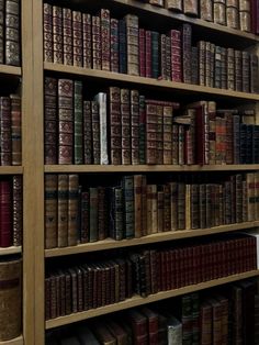 an old book shelf filled with lots of books