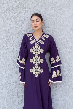 **Note : The kaftan in the video is a different color and is only displayed to show the fit, flow, and cut of the Kaftan. You will receive the one in the pictures.** Feel like royalty in this Kaftan maxi dress with its mono tone embroidery, a royal look made of extremely soft cotton, light and extremely soft and can be used on many occasions - dinners, gatherings, beach, lounge, or even in your home to feel comfortable.  Fabric : 70% Egyptian Cotton; 30% Polyester. Sizes : The dress comes in two Eid Floral Embroidered Tunic Abaya, Festive Purple Embroidered Kaftan, Festive Embroidered Purple Kaftan, Bohemian Dresses With Dabka Work, Traditional Embroidered V-neck Dress For Eid, V-neck Dress With Intricate Embroidery For Eid, Traditional Resham Embroidery V-neck Maxi Dress, Floral Embroidered Floor-length Maxi Dress For Eid, Floor-length Maxi Dress With Floral Embroidery For Eid