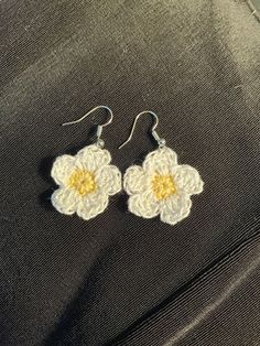 Cute lightweight daisy earrings. Hand crocheted. Handmade Flower Earrings For Everyday Spring Wear, Spring White Earrings With Ear Wire, White Flower Charm Earrings For Everyday, White Earrings With Ear Wire For Spring, White Daisy Flower Earrings For Spring, White Flower Earrings For Crafting, White Crochet Dangle Earrings, Handmade Daisy White Earrings, Handmade White Daisy Earrings