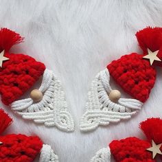 red and white crocheted hats with angel wings, stars and beads on them