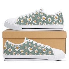 A cute pair of floral sneakers with a daisy print. These custom sneakers are printed canvas with rounded toe and lace-up closure for a snug, comfortable fit. Eyelets are metal for that classic look. The sneakers feature a soft textile lining with lightweight construction for maximum comfort and high-quality outsole for traction and exceptional durability. Please note, these shoes are not a brand name shoe and designs are permanently printed on to the canvas before the shoe is constructed by hand Summer Low-top Skate Shoes With Vulcanized Sole, Cute Green Sneakers For Spring, High-top Floral Print Sneakers For Spring, Green Cotton Sneakers For Spring, Summer Skate Shoes With White Rubber Sole, Sporty Floral Print Sneakers With Round Toe, Spring Cotton Round Toe Skate Shoes, Cute Low-top Spring Sneakers, Cute Lace-up Cotton Sneakers