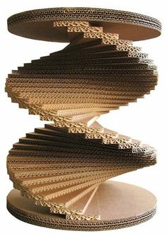 several stacks of folded papers stacked on top of each other in the shape of a spiral