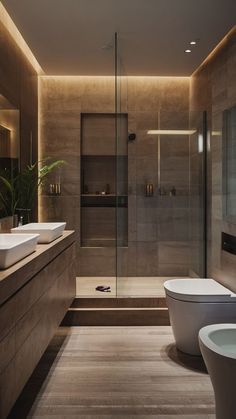 a modern bathroom with two sinks and a toilet