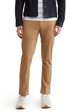 A solid hue makes these chino pants a versatile, everyday classic staple for your closet. 9" rise, 32" inseam (size 32x32) Trim fit Zip fly with button closure 2 front slash pockets; 2 back button welt pockets 97% cotton, 3% spandex Machine wash, tumble dry Imported Fitted Straight Chinos For Fall, Slim Fit Straight Leg Solid Chinos, Solid Color Slim Fit Straight Leg Chinos, Slim Fit Straight Leg Chinos, Fitted Chino Cotton Twill Straight Leg Bottoms, Fitted Chino Cotton Twill Bottoms With Tapered Leg, Fitted Chino Cotton Twill Bottoms With Straight Hem, Fitted Chino Cotton Twill Pants For Fall, Stretch Solid Color Straight Leg Chinos