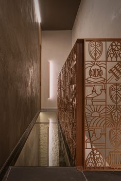 the hallway is decorated with intricate metal screens