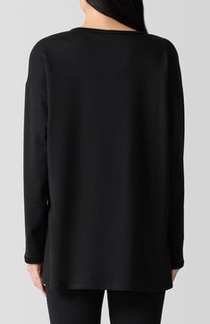 Minimalist ease defines this boxy-fit long-sleeve top that's crafted from a soft, sustainable blend for a casual look on your off-duty days. 29" length Crewneck Long sleeves 65% Tencel® lyocell, 28% organic cotton, 7% elastane Tencel lyocell is a more-sustainably produced fiber made with closed-loop processing Machine wash, dry flat Made in the USA Oversized Long Sleeve Minimalist Tops, Modern Long Sleeve Sweatshirt For Layering, Oversized Fall Tops With Straight Hem, Oversized Tops With Straight Hem For Fall, Minimalist Black Top For Fall, Fabric Gifts, Free Fabric, Casual Look, Look On