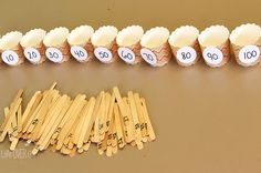 several matches are lined up next to each other on the table with numbered matches in them