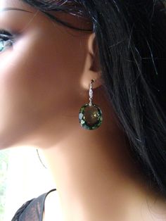 Sale, $25 off. Handmade, luxury pair of earrings comprised of stunning, rare oval green with blue hue Amethyst stones attached to sterling silver Pave ear wires studded with tiny, sparkling, diamond like CZ. Great gift for her, they will be a family heirloom for years to come. Gorgeous, AAAA+ quality stones measure : 1) 40 ct. total. Each stone is 23 x 12 x10 mm. As photo. Sold out. 2) 32 carats total, each 19 x 15 x 9 mm. 3) 52 carats, each stone is 23 x 20 mm. 4) 30 carats, each stone is 20x 1 Sterling Silver Gemstones For May Birthstone And Formal Occasions, Elegant May Birthstone Gemstones, Elegant Sterling Silver May Birthstone Gemstones, Elegant Gemstones With Gemstone Accents For May Birthstone, Elegant Gemstones With May Birthstone Accents, Elegant Green Gemstones For Formal Occasions, Elegant May Birthstone Gemstones With Accents, Fine Jewelry Oval Sterling Silver Earrings, Exquisite Oval Earrings With Prong Setting