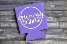 a purple box with the words giveaway drinker on it sitting next to a wooden wall