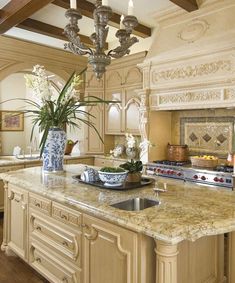 a large kitchen with an island and chandelier