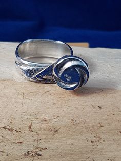 "Silver ring in Japanese style. The ring is like a square. The decoration is an origami flower stem with a moulded flower of recycled silver. Ring size is 17,2 mm (11/16\"), eq. of UK N 1/2, or US 7." Flower Stem, Origami Flowers, Recycled Silver, Japanese Style, The Netherlands, Silver Ring, Netherlands, Origami, Jewelry Rings