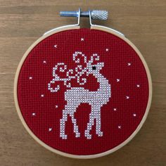 Hand stitched nordic inspired Christmas decoration depicting the silhouette of a reindeer.  The finished piece is displayed in an 8cm (3") wooden embroidery hoop, backed with felt. Thanks for looking! Christmas Sweater Cross Stitch, Simple Cross Stitch Pattern, Free Cross Stitch Patterns Printable, Christmas Cross Stitch Charts, Cool Cross Stitch Patterns, Mini Christmas Cross Stitch, Flower Charts, Christmas Cross Stitch Alphabet, Reindeer Cross Stitch