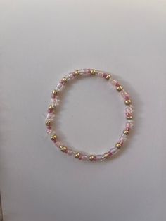 red, white, gold, and pink beaded tie bracelet! Pink White Gold Beaded Bracelet, Dainty Pink Beaded Bracelet With Letter Beads, Dainty Pink Beaded Bracelets For Spring, White Dainty Beaded Bracelets For Valentine's Day, Playful Pink Bracelets With Tiny Beads, Mini Beads Bracelet, Beaded Tie, Pink Beaded Bracelets, Pink Beaded