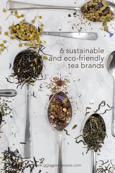 spoons filled with various types of tea on top of a table