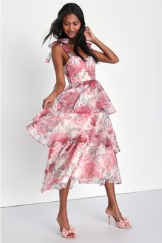 From garden parties to bridal showers, the Lulus Playfully Posh Blush Floral Organza Tie-Strap Tiered Midi Dress will be the perfect pick for any elegant occasion! Sleek woven organza, adorned with a dreamy floral print, shapes this lovely dress that features tying straps that supports a sweetheart neckline and a bustier-inspired bodice with seamed cups and supportive boning throughout. The fitted waist tops a flouncy tiered skirt that falls to a sophisticated midi hem. Hidden back zipper/clasp. Garden Wedding Guest Dress Summer, Garden Wedding Guest Dress, Bridal Shower Guest Outfit, Midi Dress Pink, Lulu Fashion, Tiered Midi Dress, Garden Parties, Pink Midi Dress, Tier Skirt