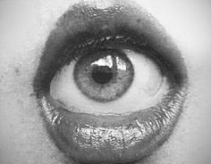 an eye with the words, the mouth reveals the person inside, there is closely to the words within it's words