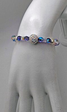 Swarovski Tanzanite and Crystal Memory Bracelet - Etsy Crystal Bracelet With Rhinestones And Round Beads, Crystal Bracelet With Round Rhinestones, Sparkling Crystal Bracelet, Sparkling Crystal Round Bracelet, Sparkling Round Crystal Bracelet, Luxury Tanzanite Gemstone Bracelet, Luxury Silver Tanzanite Bracelets, Purple Hand-strung Crystal Round Bracelet, Adjustable Multicolor Multi-stone Crystal Bracelet