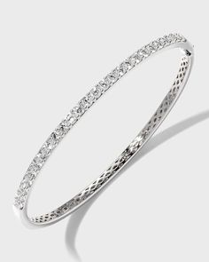 Diamond fashion bangle from Memoire..Polished 18-karat white gold hardware..26 round-cut, prong-set G-H/SI diamonds..Hinged opening with fold-over clasp..1.97 total diamond carat weight. Classic Pave Setting Bangle For Formal Events, Classic Pave Setting Bangle For Formal Occasions, Luxury Brilliant Cut Bangle For Anniversary, Classic Bangle With Pave Setting For Formal Occasions, Timeless Bangle With Pave Setting For Formal Occasions, Classic Formal Bangle With Pave Setting, Diamond White Diamond Bangle With Pave Setting, Luxury Round Bangle With Pave Setting, Classic Round Bangle With Diamond Accents