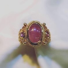 18K Yellow Gold Luxury Oval Cabochon Ruby Ring, Luxury Ruby Ring With Cabochon Cut, Luxury Hallmarked Oval Cabochon Sapphire Ring, Luxury Collectible Sapphire Ring, Luxury Ruby Oval Cabochon Ring, Luxury Ruby Ring Oval Cabochon, Luxury Cabochon Ruby Ring For Anniversary, Formal Gold Oval Cabochon Sapphire Ring, Gold Oval Cabochon Sapphire Ring For Formal Occasions