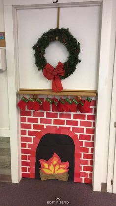 a fire place with a wreath on top