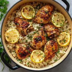 chicken thighs with lemons and rice in a pan