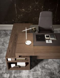 a desk with a chair and a book shelf