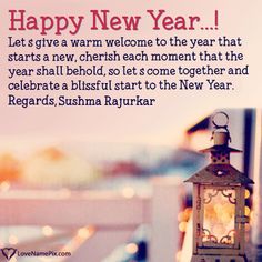 a lantern sitting on top of a wooden table next to a white fence with the words happy new year