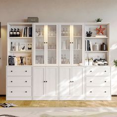 a living room filled with white furniture and lots of shelves