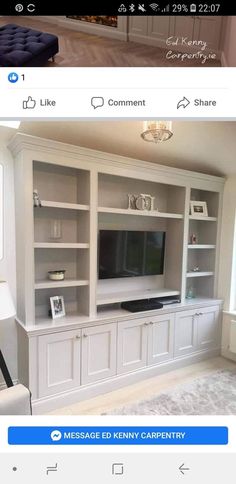 a white entertainment center with built in cabinets