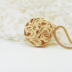 Inspired by Yun Boutique logo, this Auspicious Flower pendant embraced ancient Chinese filigree jinlay art with classic modern elegance. Adjustable chain can be styled with difference collar shapes. Not to be confused with regular gold plating, our vermeil is a thick layer of 18k solid gold on sterling silver. Chinese filigree inlay art is a delicate kind of jewelry metalwork, usually of twisted threads made of gold, silver, and copper, soldered together and arranged in artistic motifs with moun Elegant Brass Pendant Necklace, Luxury Medallion Necklace For Formal Occasions, Luxury Engraved Medallion Pendant Necklace, Elegant Locket Necklace For Ceremonial Occasion, Formal Brass Jewelry With Intricate Design, Luxury Brass Jewelry For Ceremonial Occasions, Elegant Engraved Pendant Necklaces, Formal Intricate Brass Jewelry, Elegant Engraved Pendant Necklace