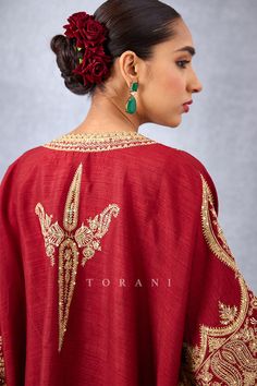 Editor's Note Featuring a bright red free styled kaftan having heavy embroidered yoke along with straight cut fit pants Color: Red Fabric: Slub silk Components: Kaftan and pants Embroidery details: Hand embroidery, dori and hand adda work Fit: Loose Occasion: Festive Care: Dry Clean Only About the Designer Torani by Karan Torani stands handcrafted luxury inspired by the myriad tales of Indian mythology. Torani is a potpourri of all things nostalgic that binds you with a memory long forgotten. Th Dori Work Embroidery Design, Kaftan And Pants, Heavy Suits, Pants Embroidery, Kaftan Set, Bandhej Print, Dori Embroidery, Long Kurtas, Indian Mythology