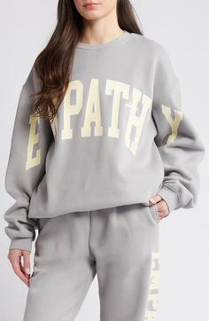 Channel your empathetic side in this comfy cotton-blend sweatshirt with athletic-style lettering spanning arm to arm. 29 1/2" length (size Medium/Large) Crewneck Long sleeves Ribbed cuffs and hem 51% cotton, 49% polyester Machine wash, line dry Imported Oversized Letter Print Sweats In Sportswear Style, Oversized Letter Print Sweats Sportswear, Oversized Letter Print Sportswear Sweats, Oversized Gray Varsity Sweatshirt, Oversized Letter Print Sweats In Athleisure Style, Oversized Letter Print Sweats For Athleisure, Gray Crew Neck Sweats With Letter Print, Gray Letter Print Crew Neck Sweats, Oversized Sporty Sweatshirt With Letter Embroidery