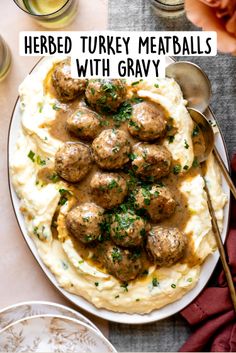 meatballs and mashed potatoes with gravy in a white bowl on a table