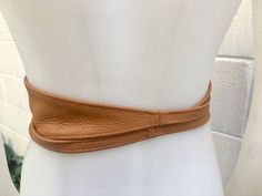 Camel brown OBI BELT in genuine leather. Wrap belt in tan color . Waist belt in soft natural leather. Tobacco brown leather belt. Saddle brown sash. Wraparound brown belt. The belt is 220 cm (86 inch) long and 8,3 cm (3 1/4 inch) at its widest (front) it gets smaller towards the end up to 1 cm (1/2 inch). 220 cm (86 inch) long and 8 cm (3 inch) at its widest (front) it gets smaller towards the end up to 1 cm (0,4 inch). https://www.etsy.com/listing/190889352/black-suede-obi-belt-in-natural-soft? Adjustable Brown Belt, Brown Waist Belt, Adjustable Brown Belt With Self Belt Detail, Adjustable Rustic Brown Belt, Brown Obi Belt, Leather Wrap Belt, Leather Obi Belt, Small Coin Purse, Wrap Belt