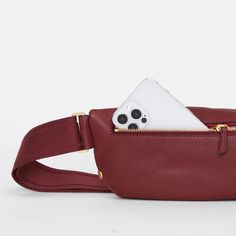 This updated take on our internet famous belt bag embraces the crossbody styling our fans have come to love, with size inclusivity in mind. Plus, its long strap allows you to truly wear this style as a low slung crossbody, in addition to over your chest. A classic soft pebbled leather with a hint of shine, this delicious jewel toned red is a timeless holiday staple. Named after the fresh pasta al pomodoro, this leather also features a dark brown accent edge paint for a subtle contrast. Internet Famous, Leather Belt Bag, Painting Edges, Jewel Tones, Luxury Handbags, Pebbled Leather, Leather Belt, Belt Bag, Handbags