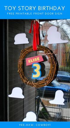 a birthday door hanger with a number 3 hanging from it's front window