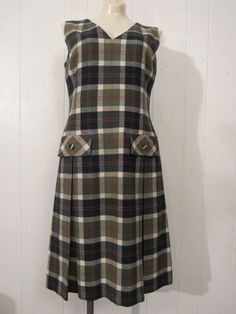 "Vintage 1970s school girl dress. Made of green and white plaid wool. Has a back zipper and two faux waist pockets. Size medium. Measurements are: 38\" around the bust 33\" around the waist 40\" around the hips 15\" shoulder to shoulder 41\" overall length In very good condition." 1970s School, Dress School, 1970s Dress, 1970s Dresses, 60s Mod, Clothes Outfits, Pretty Clothes, Recycle Clothes, Wool Dress