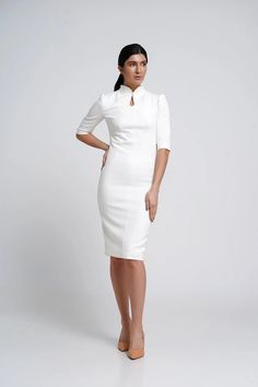 Elegant High Neck Bodycon Dress For Work, Elegant Formal Fitted Ao Dai, Formal Fitted Stand Collar Cheongsam, White Fitted Dress With Stand Collar, White Fitted Cheongsam For Party, Fitted White Ao Dai With Stand Collar, Elegant Spring Dress With Band Neckline, Elegant Fitted Dress With Stand Collar, Spring Formal Knee-length Cheongsam