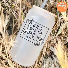 a white mason jar with the words don't love me on it sitting in some dry grass