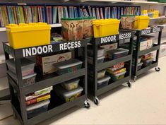 several bins are stacked on top of each other in the library