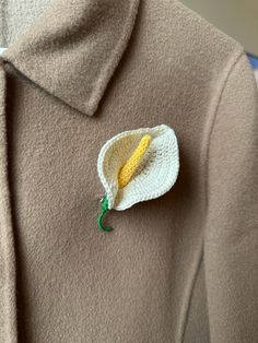 a close up of a jacket with a flower on it