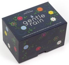 a black box with flowers on it and the words gentle rain written in white letters