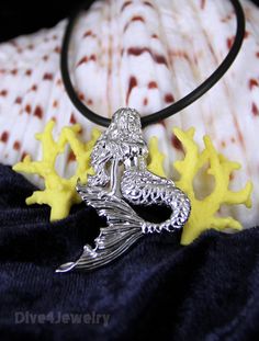 "Solid Sterling silver highly detailed Mermaid pendant necklace Comes with one Black Neoprene Necklace: 16-18\" or 18-20\" or 20-22\" or a 17\" silver tone ball chain Mermaid Size: 3.55cm x 3cm Pendant Weight: approx. 6.5 grams Pendant Metal type: Solid 925 STERLING SILVER with Anti-Tarnish RHODIUM Finish Item Stamped \"925\" for Sterling Silver New handmade style - designed by a scuba dive lover! ** I designed and we created this item. Owned by Dive4Jewelry** **Follow me on facebook for special Silver Sterling Silver Mermaid Necklaces, Adjustable Silver Necklace With Ocean-inspired Style, Silver Adjustable Ocean-inspired Necklace, Adjustable Silver Ocean-inspired Necklace, Ocean-inspired Silver Charm Necklace With Lobster Clasp, Ocean Girl, Fish Jewelry, Mermaid Pendant, Scuba Dive