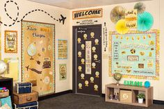 an office decorated with bulletin boards and suitcases in front of the door that says welcome