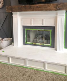 the fireplace is painted white with green trim