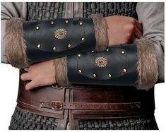 PRICES MAY VARY. Material: Crafted with PU Leather and Fuax Fur. Adjustable, Durable, Comfortable, and Soft. With classic leather look and authentic historical touch. Unisex Appeal: These Viking arm guards Bracers are designed to fit both men and women, offering a versatile accessory for any warrior ensemble. Comfortable Fit: 1 - Medieval buckle closure provides a secure fit for all arm sizes, while adding an 2 - Soft faux fur lining ensures comfort during extended wear, allowing you to fully im Medieval Belt, Leather Bracers, Arm Guard, Halloween Cosplay, Classic Leather, Larp, Belt Buckles, Pu Leather, Vikings